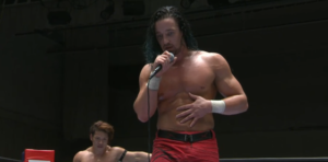 歓声の上がる矢野の金的攻撃とブーイングの上がるジェイホワイトの金的攻撃